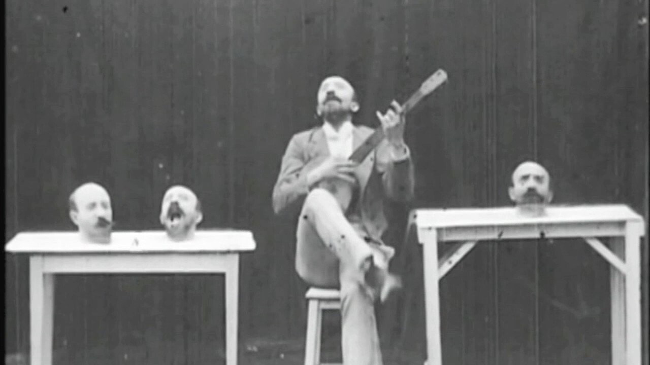 The Four Troublesome Heads (1898) backdrop artwork